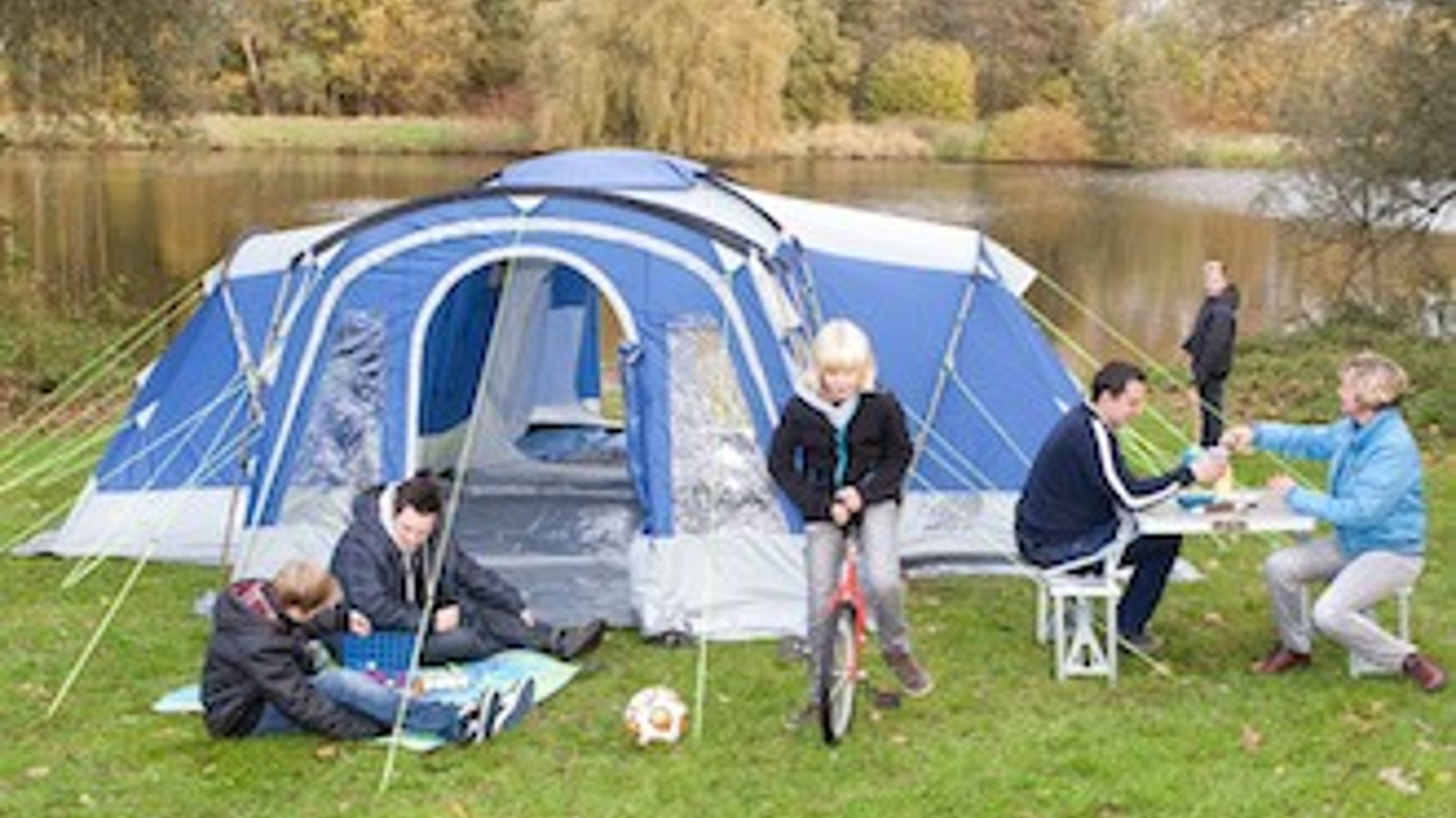 Photo of family with a tent at the campsite