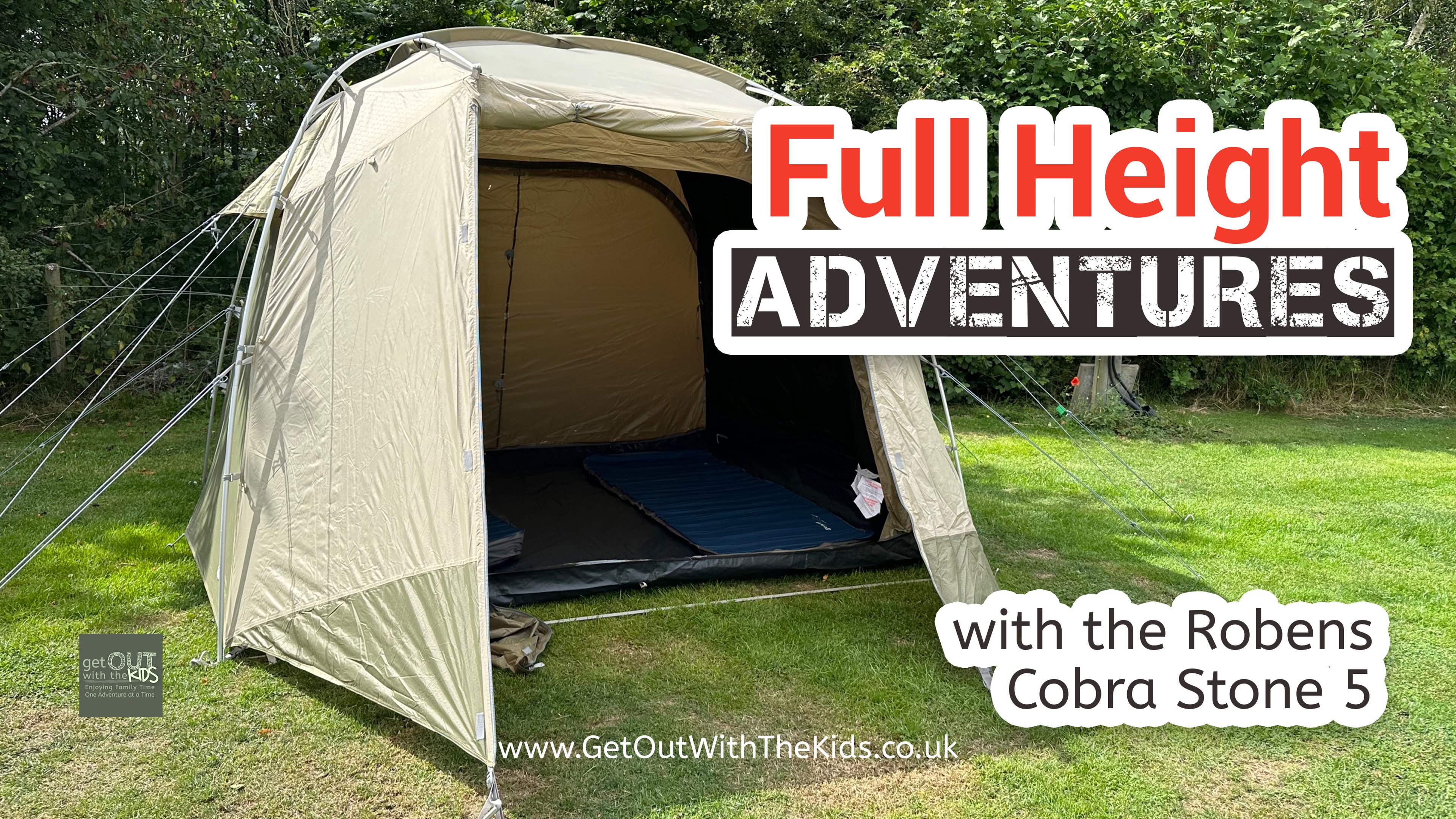 The Robens Cobra Stone 5 tent pitched at a campsite with the door of the tent open 