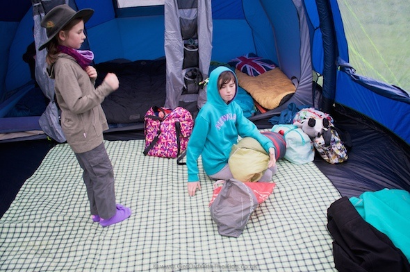 Kids setting up their bedrooms inside the Outwell Hornet XL