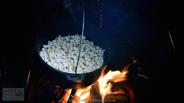 Cooking popcorn over the campfire