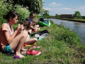 Enjoying a picnic on the side of the canal