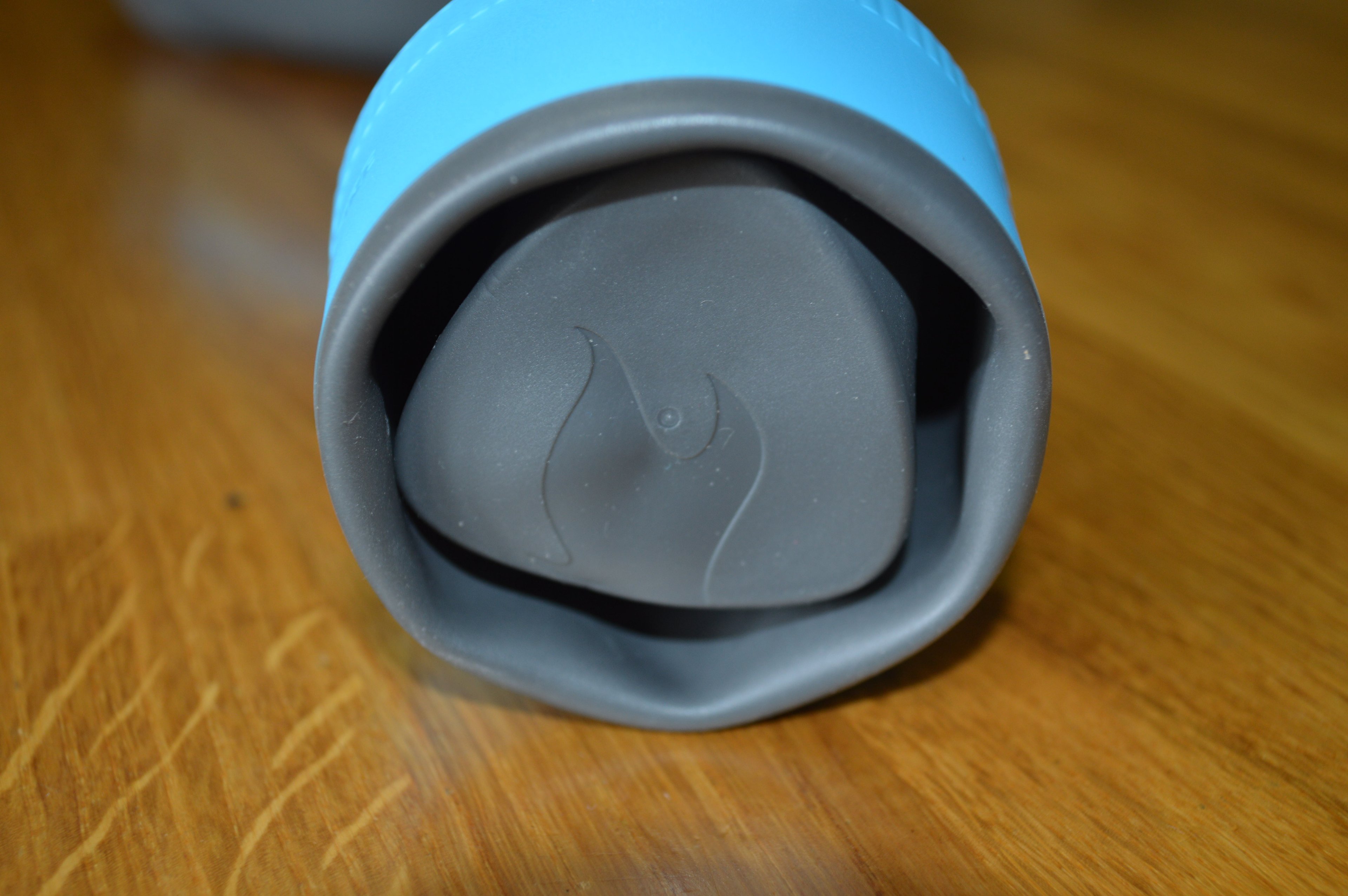 The cup's flexible bottom folds into the top of the cup