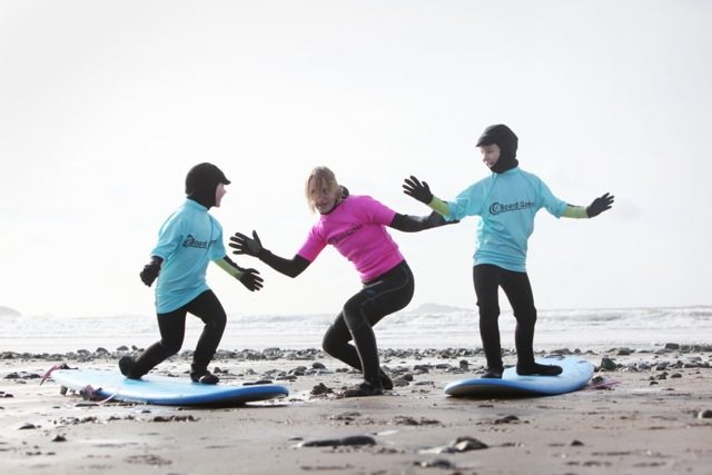 Children learning to surf