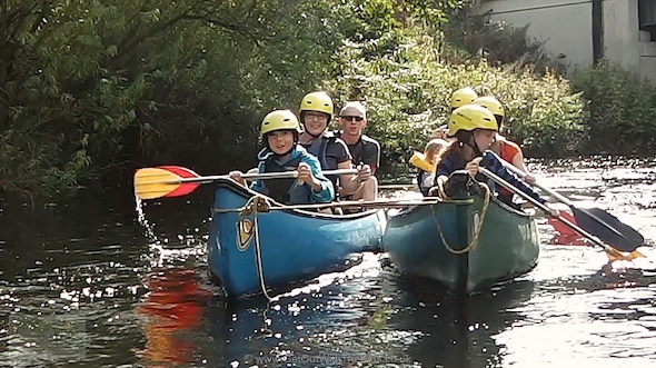 Safe family canoeing with boats made into a raft