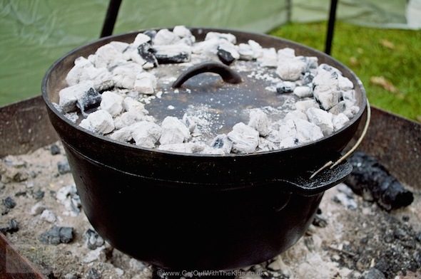 Coals on top of the Dutch Oven in the campfire