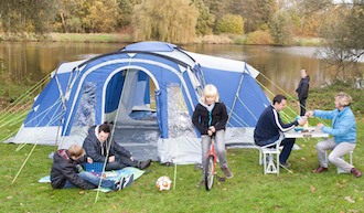 Photo of family with a tent at the campsite