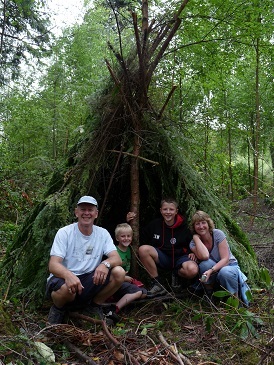 A forest shelter made with bushcraft skills