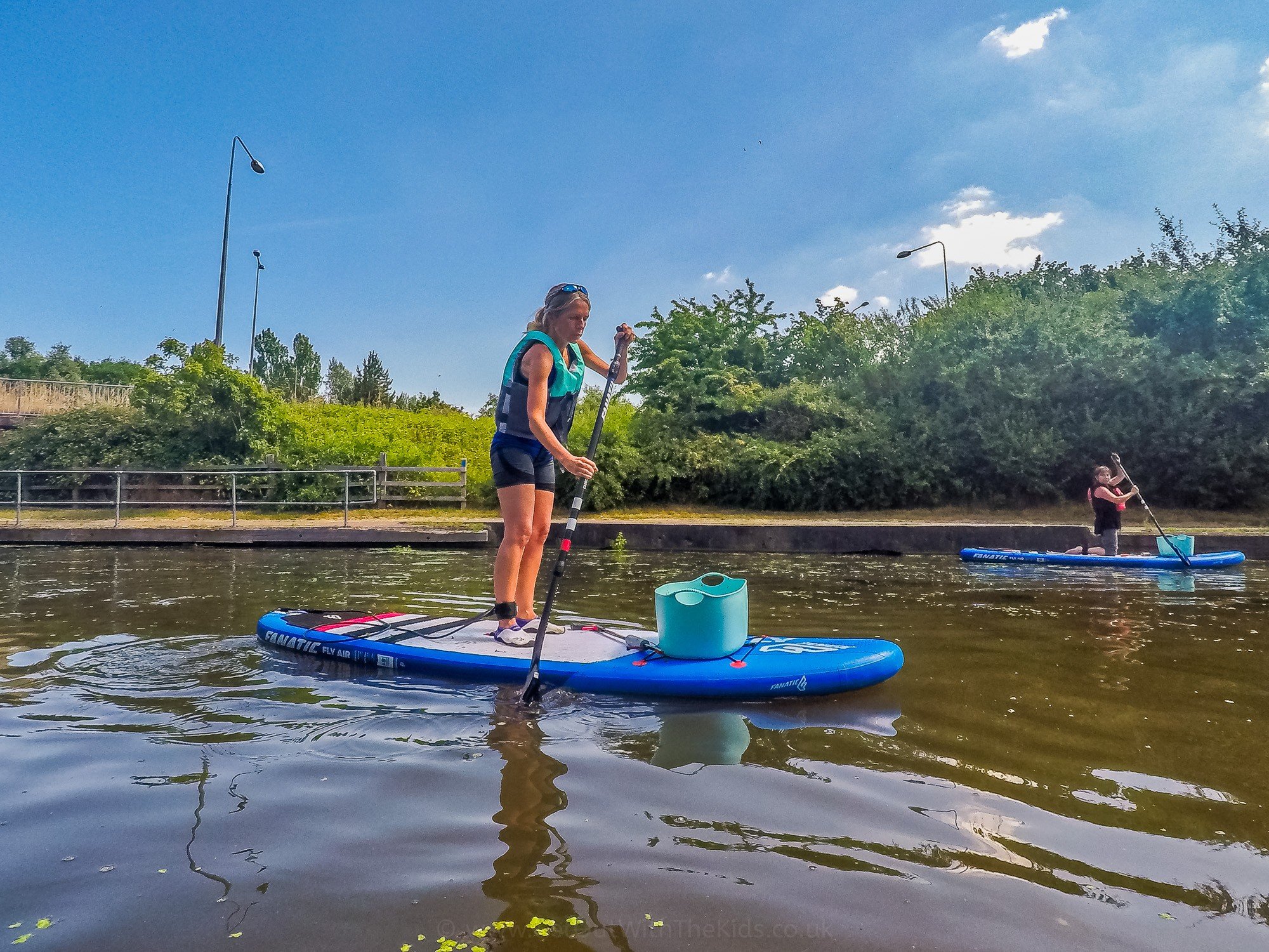Collecting rubbish using a stand-up paddleboard