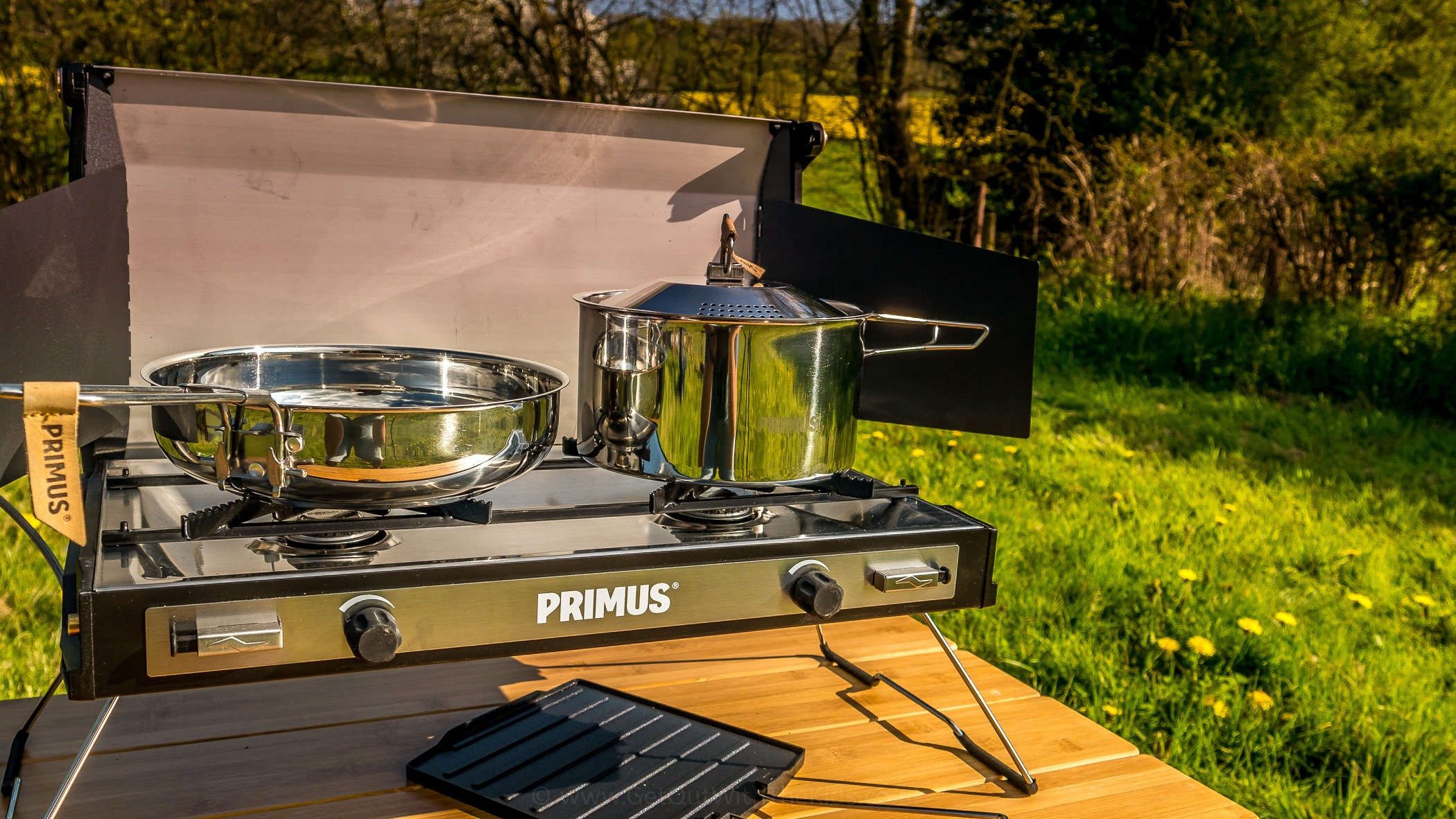 The polished stainless steel of the campfire cookset
