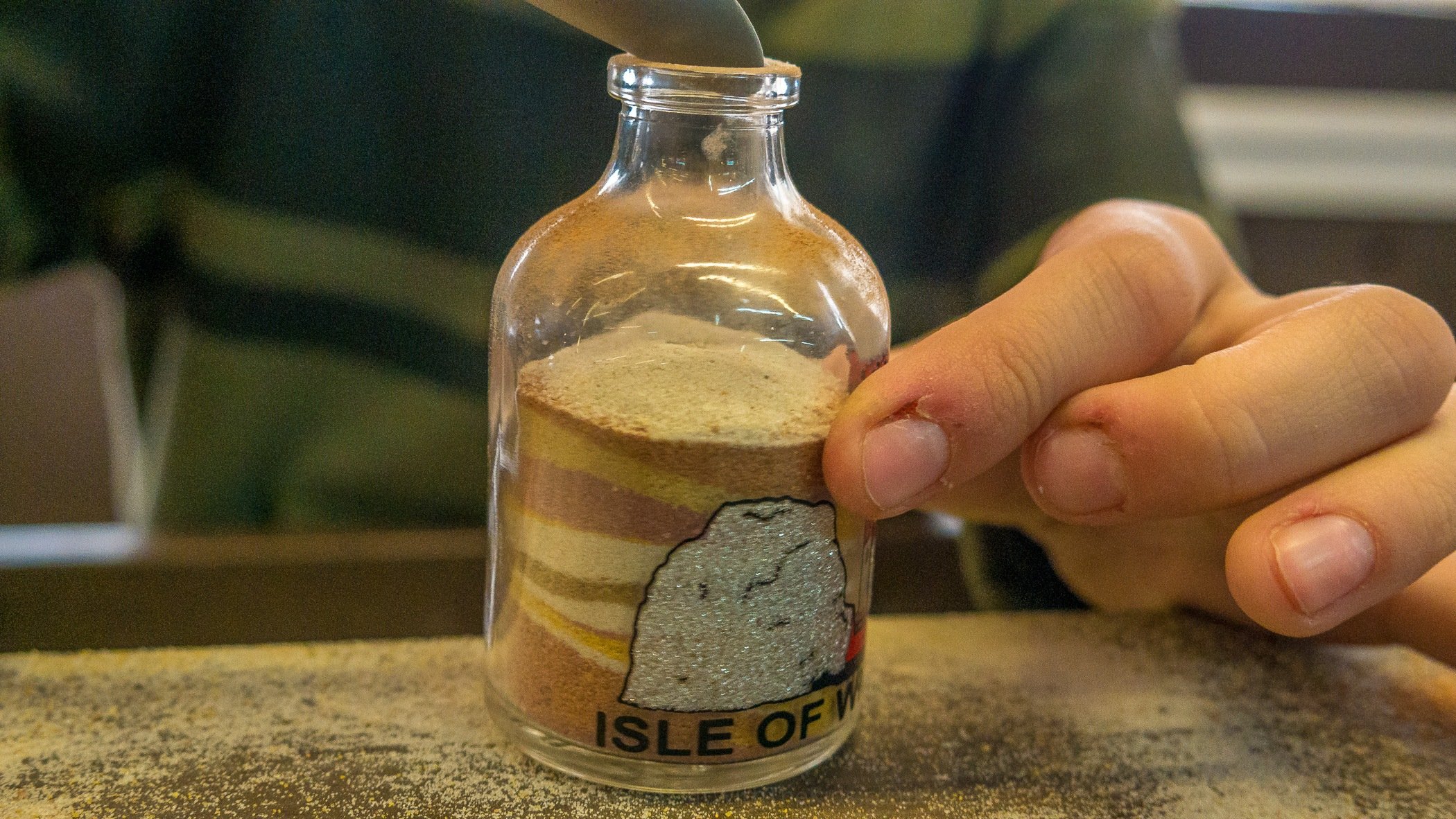  You can make your own layered sand souvenirs.