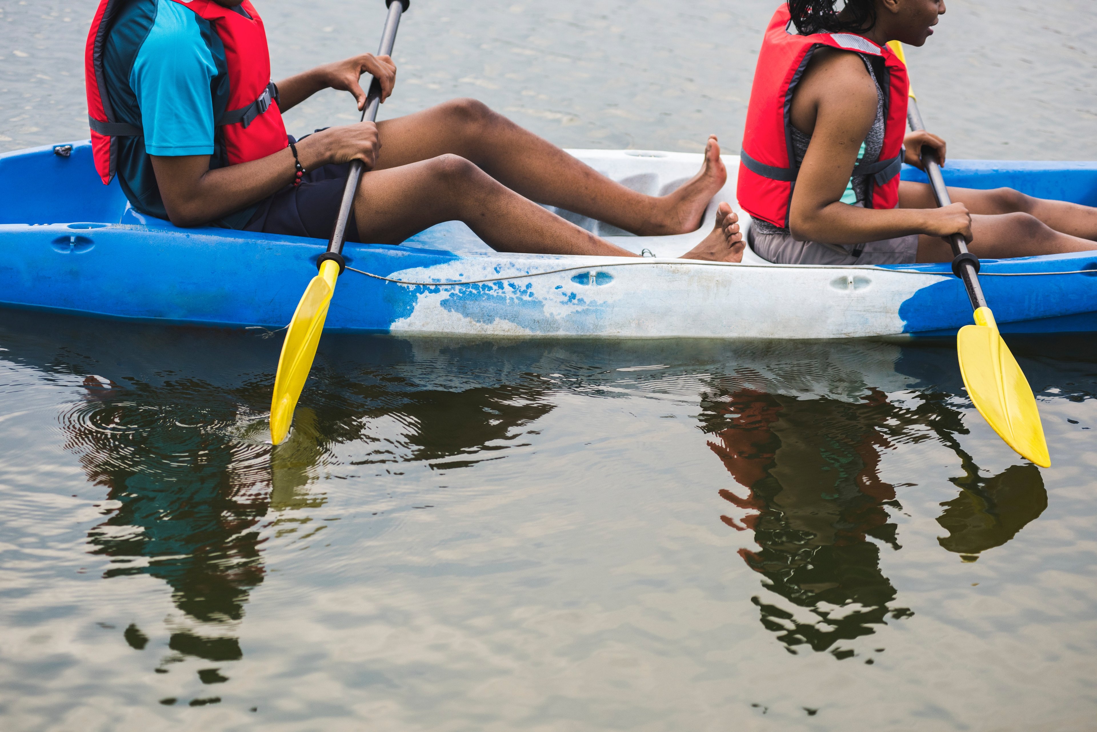 Teenagers on sit-on-top kayak
