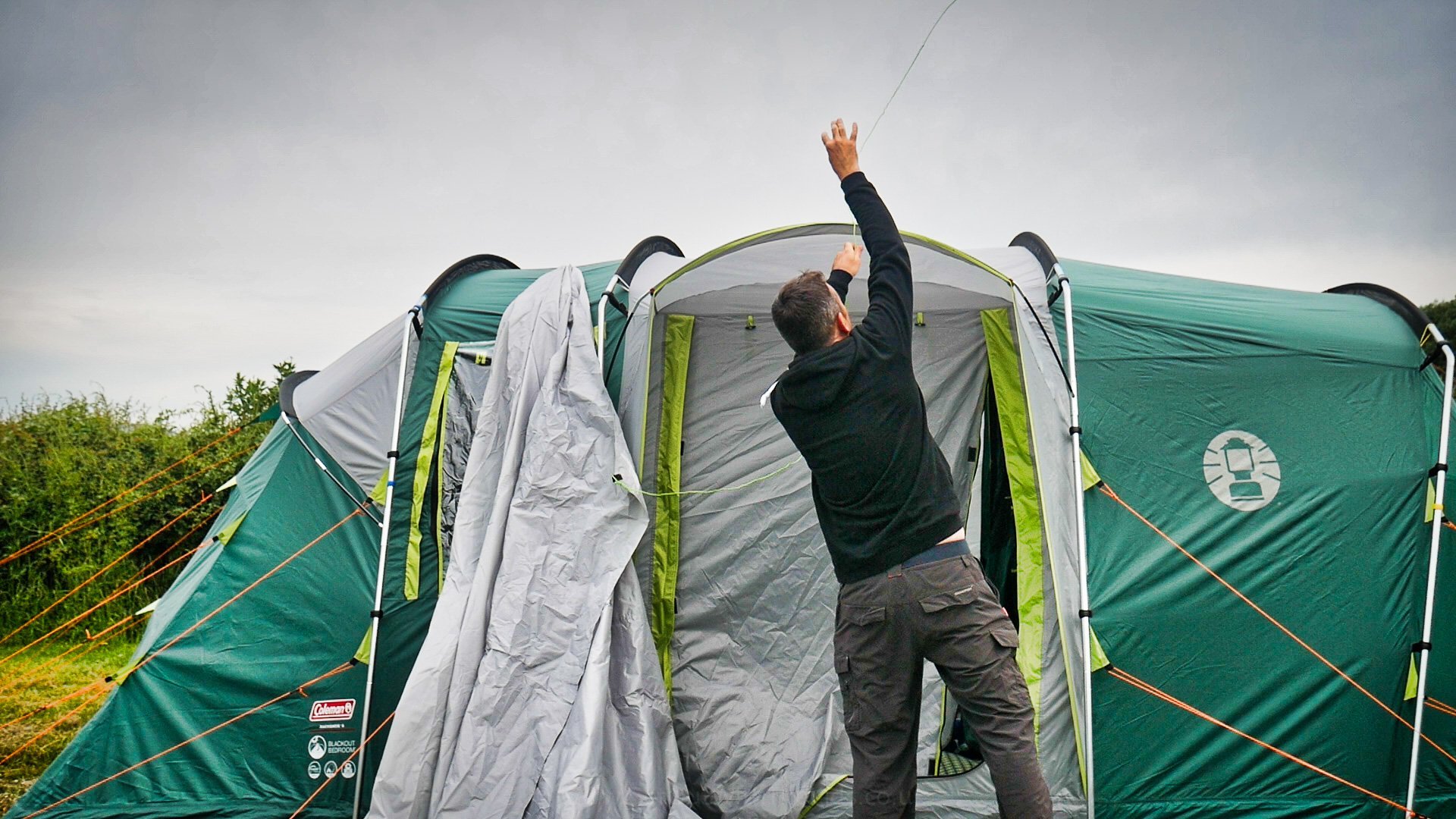 Throwing the guy lines over the tent