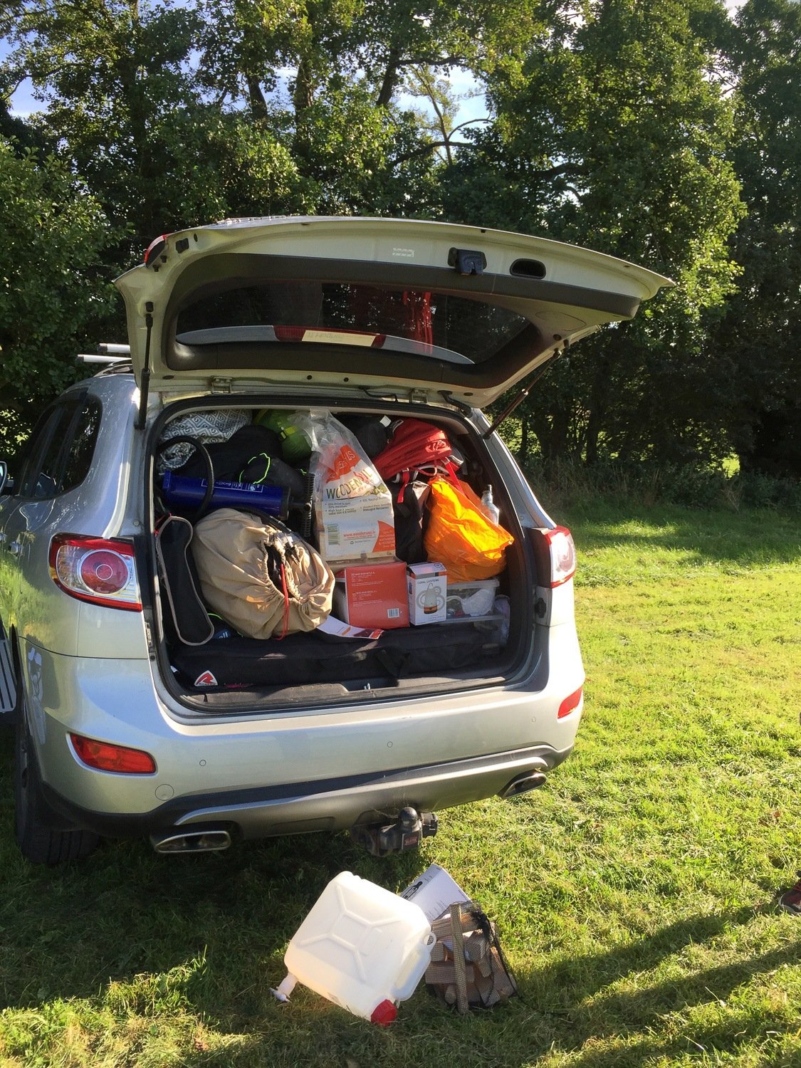 Car packed with camping gear