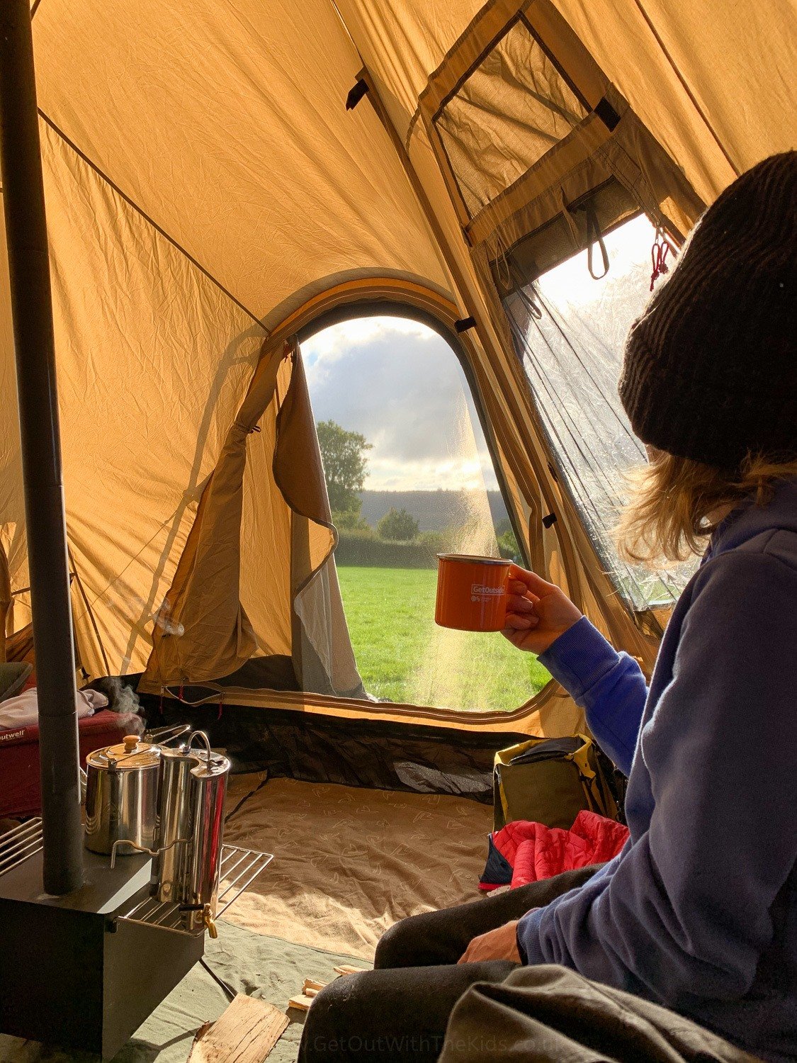 In tent with warm drink