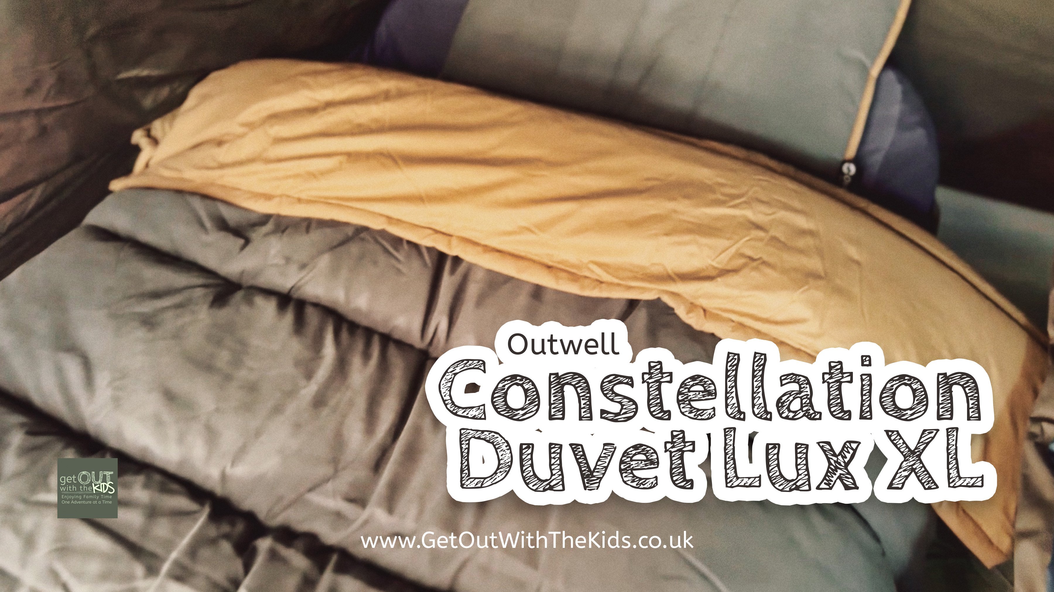 Photo of the Constellation Duvet Lux XL made up on a camp bed along with pillow