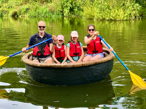 Family in a coracle on the River Severn