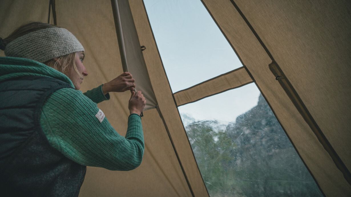 Woman toggling the window blinds