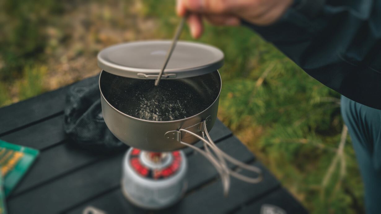 Titanium pot cooking at campsite