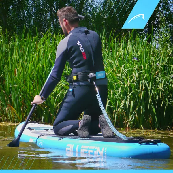 Paddler on the water with the leash attached to the Releash belt